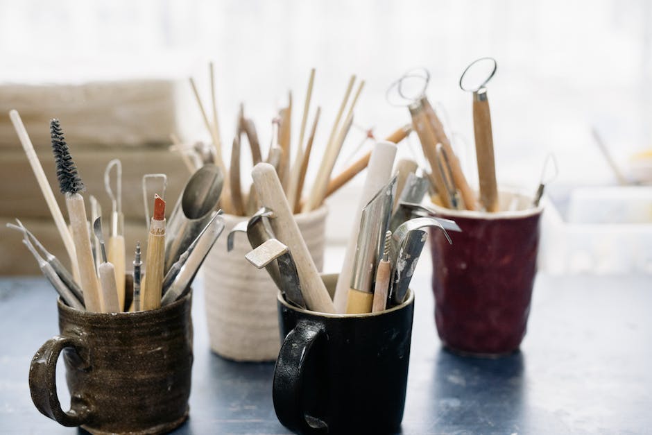 Image of a person holding artistic tools, representing the concept of portfolio careers for creative professionals.